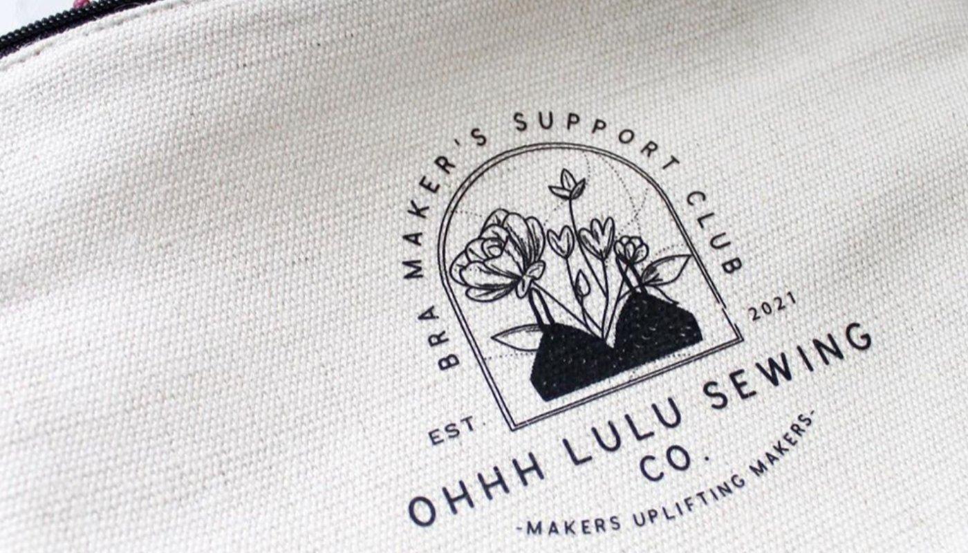 custom printed pouch with business logo to illustrate appeal of making merch for your small business